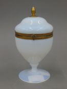 An opaline glass urn shaped box. 17 cm high.