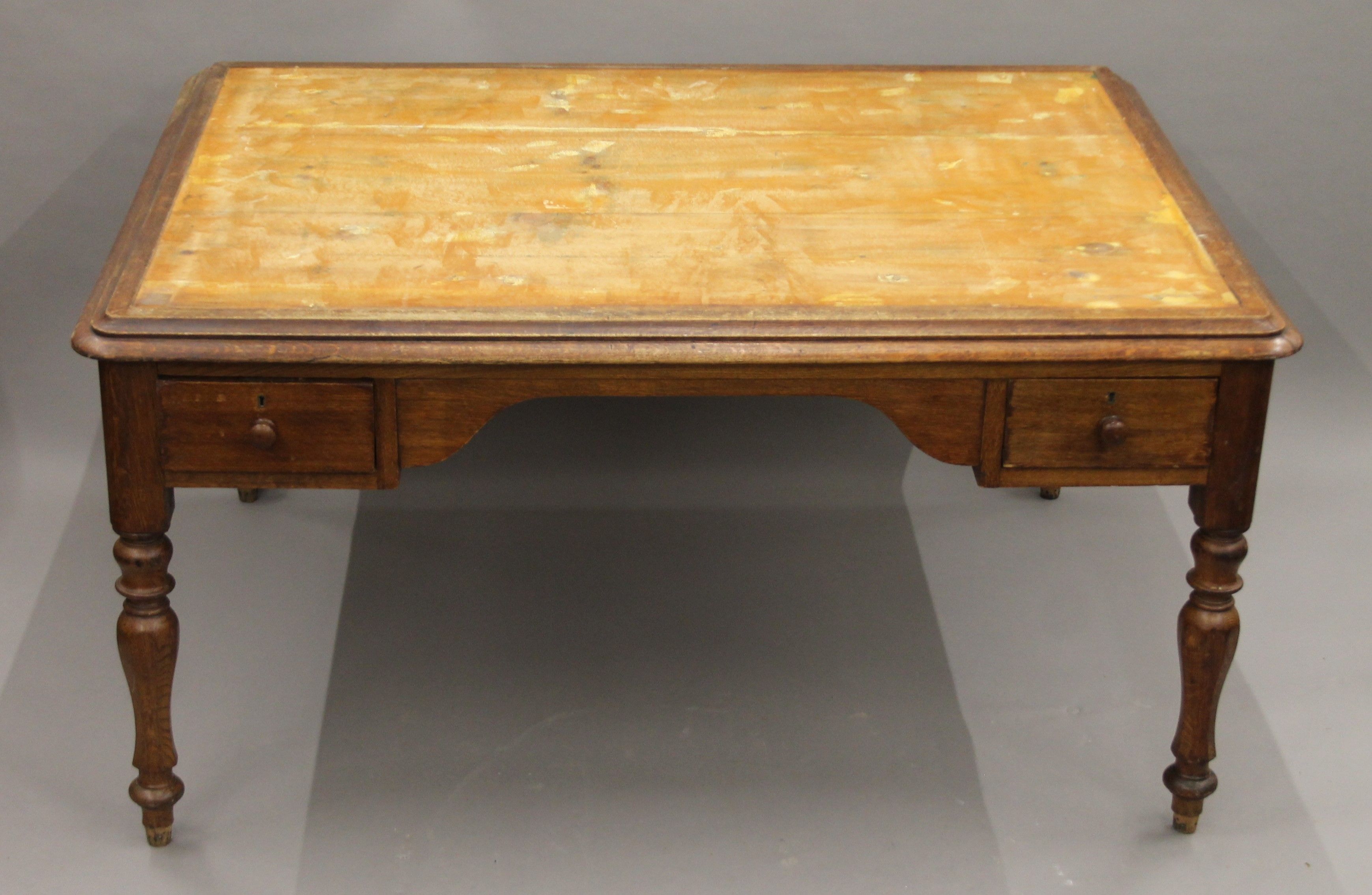 A Victorian oak partner's writing table. 153 cm wide.