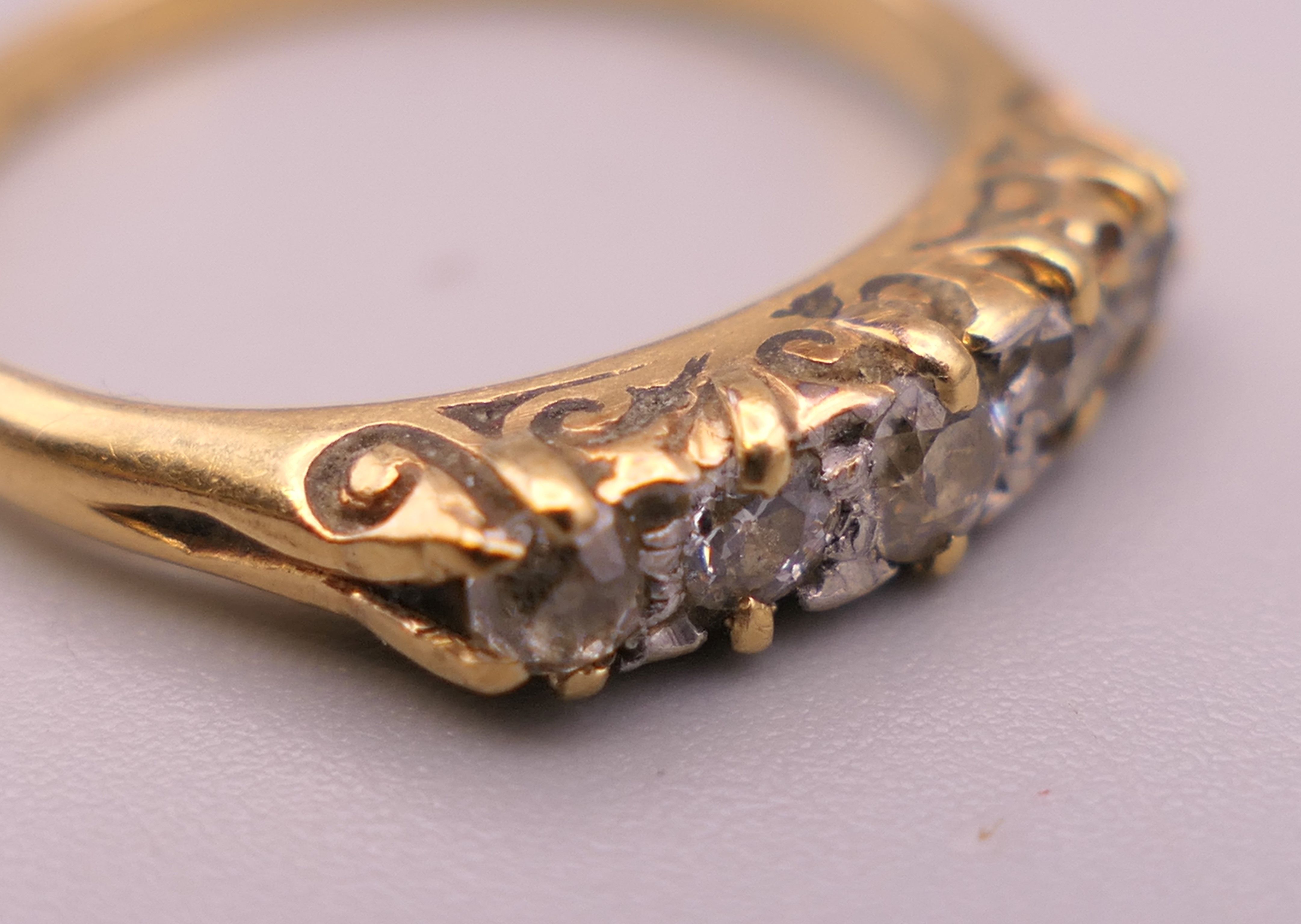 An 18 ct gold five stone diamond ring. Ring size I/J. 1.9 grammes total weight. - Image 4 of 6