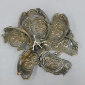 A set of eight Art Nouveau handles.