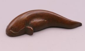 A bronze model of a catfish. 5.75 cm long.