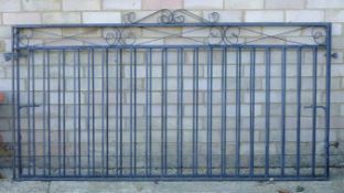 A pair of wrought iron gates. Each 175 cm wide.