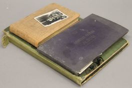 A postcard album, a photograph album and a sketch book.