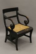 An ebonised metamorphic library chair. 55 cm wide.