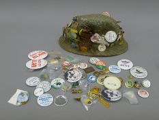 A collection of various countryside sporting related badges, some mounted on a tweed hat.