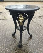 A wooden topped cast iron pub table. 59 cm diameter.