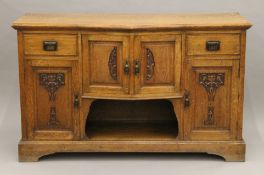 An Arts and Crafts oak sideboard. 154 cm wide.