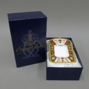 A boxed Royal Crown Derby Old Imari pattern photograph frame, pattern number 1128. 17.5 cm high.