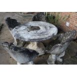 Weathered composite Victorian grotto style circular table on exotic beast column and stepped