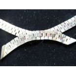 Late C20th hallmarked 9ct gold three tone textured brick link articulated necklace with cross over