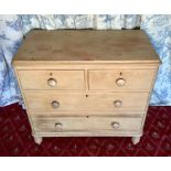 Victorian pine chest of two short above two long graduated moulded drawers, turned wooden handles