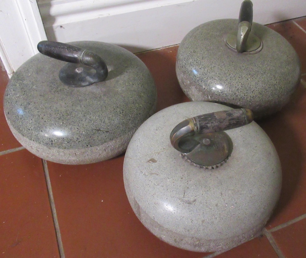 Three polished Scottish granite curling stones, chromed handles with wooden grips, D36cm (3)