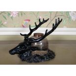 C20th painted cast iron ink stand, glass well with brass top on stags head pen rack type base, H13cm