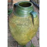 Terracotta olive jar barrel with circular tapering body and green glazed neck with two handles,