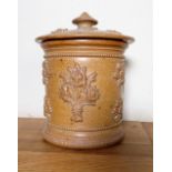 Victorian salt glazed tobacco or salt jar, cylindrical body relief decorated with floral bunches,