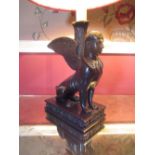 Pair of Regency style patinated bronzed metal table lamps, as winged seated sphinx on rectangular