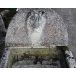 Large weathered composite D shaped water font, arched back with lions head spout, W77cm D69cm H90cm