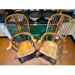 Two Victorian ash and elm high back broad arm Windsor chairs, with fir tree splats on turned