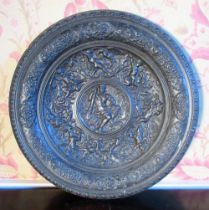 Victorian bronzed metal circular plaque, cast with Bacchus within a border of hunting scenes and