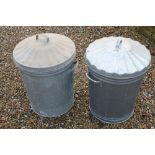 Two galvanised dustbins with lids