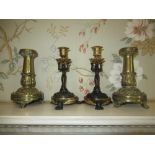 Pair of Regency style cast gilt metal Zoomorphic candlesticks modelled as Monkeys supporting