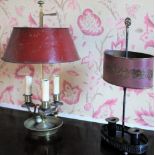 Regency style three branch gilt metal bouillotte lamp with cranberry toleware adjustable shade