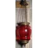 Early C20th Wiman brass mounted ruby glass lamp enclosure on three suspension chains H28cm D18cm