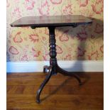 C19th mahogany tripod tea table, reeded rectangular tilt top on vase turned column and three