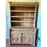 Victorian and later waxed pine dresser, three shelf back with pierced frieze, the base with two