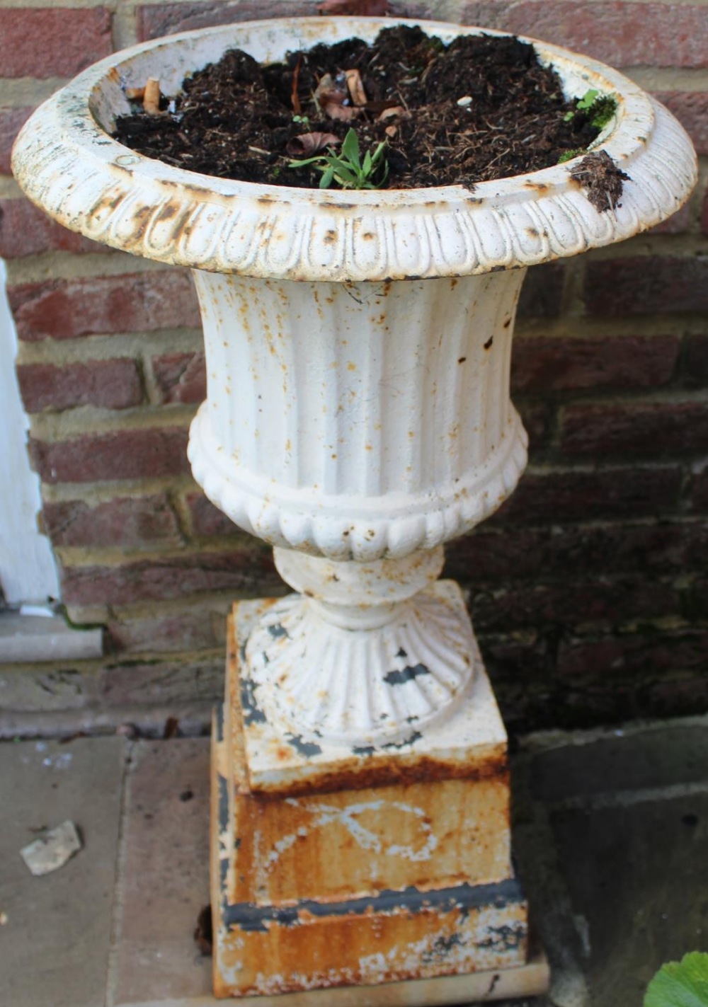 Pair of small cast iron garden urns, campagna shaped bodies on square base and tapering plinths, - Image 2 of 2