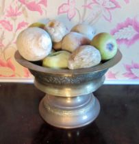 Late C19th turned brass pedestal bowl decorated with floral bands and a collection of marble