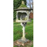 Victorian rustic style weathered composition dovecote or bird table, tapering top with bird finial