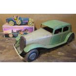 C20th English clockwork tinplate model of a saloon car printed "Made in GT Britain," and a modern