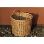 Large Country House style cylindrical wicker two handled log basket, D63cm H60cm