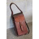 WWII leather magazine case, interior fitted for four curved magazines, leather buckle and carry
