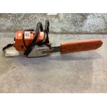 Stihl 036 petrol chainsaw with 18 inch bar and safety helmet