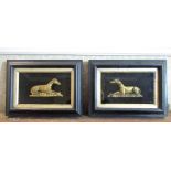 Pair of Victorian patinated cast metal half models of recumbent greyhounds, paws crossed on