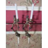 Pair of Regency style parcel gilt bronzed metal Zoomorphic candlesticks modelled as footman