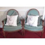 Pair of C20th French upholstered armchairs, ribbon tied carved walnut frames with leaf cresting, and
