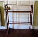 Victorian mahogany three tier towel rail, with part wrythen twist rails on arched barley twist