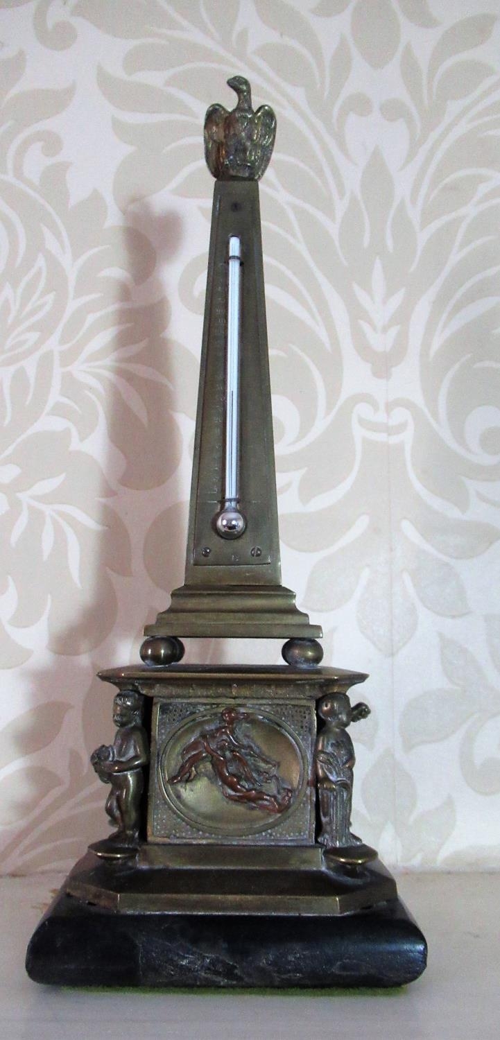 Victorian brass desk thermometer, on tapering rectangular column with eagle finial on square