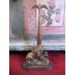 Victorian brass and cast iron door porter, in the form of a lion fighting a serpent, the handle in