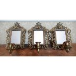 Set of three small C20th brass girandole mirrors, rectangular plates in pierced leaf work frames,