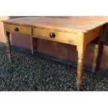 Victorian pine kitchen table, rectangular rounded top with fall leaf above two drawers with turned
