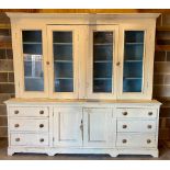 Large later painted Victorian pine dresser, moulded cornice above four glazed doors with shelves,