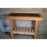 Wooden work bench with ruled measurement back, H94cm W117cm