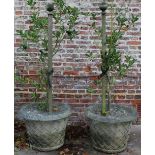 Pair of large composite garden urns, circular tapering lattice moulded bodies and shaped rim set