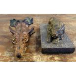 C20th gilt brass paperweight in the form of a recumbent lion on a polished slate base L13cm, and a