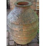 Terracotta olive jar barrel with circular tapering body with five raised bands, H65cm