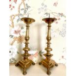 Pair of C18th brass pricket candlesticks on baluster and ring turned columns, triangular bases